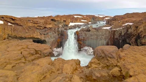 Aerial drone shot flying over Aldeyjarfoss waterfall cascading into canyon Stock Footage 343696158