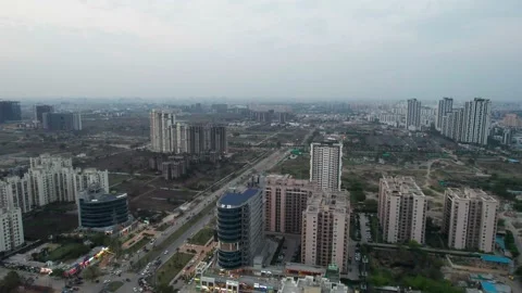 Aerial drone shot flying towards skyscraper standing tall in the middle of Stock Footage 171404792
