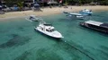 Aerial drone shot flyover anchored boats at beach in Bali Padang Bai 4k or 4k+ Resolution