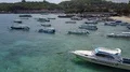Aerial drone shot flyover anchored boats at beach in Bali Padang Bai 4k or 4k+ Resolution
