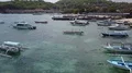 Aerial drone shot flyover anchored boats at beach in Bali Padang Bai 4k or 4k+ Resolution