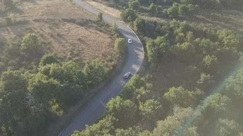 Aerial Drone Shot Following A Car Around Turns In Spain Stock Footage