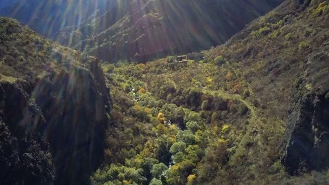 Aerial drone shot of forest ravibe between mountains with river and abandoned Video stock 81600501