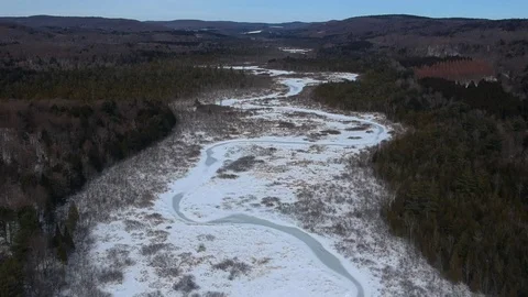 Aerial Drone shot of a Frozen Winding River Stock Footage