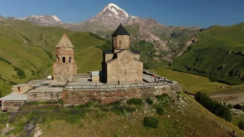Aerial Drone Shot of Gergeti Trinity Monastery and Kazbek mountain. Stepantsm Stock Footage 168242912