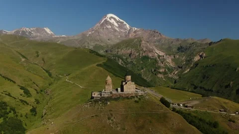 Aerial Drone Shot of Gergeti Trinity Monastery and Kazbek mountain. Stepantsm Stock Footage 168242938