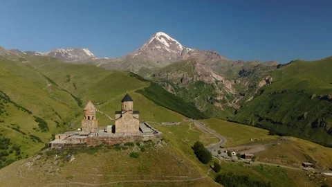 Aerial Drone Shot of Gergeti Trinity Monastery and Kazbek mountain. Stepantsm Video stock 168362120
