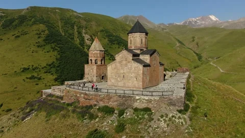 Aerial Drone Shot of Gergeti Trinity Monastery and Kazbek mountain. Stepantsm Stock Footage 168362123