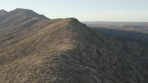 Aerial drone shot gliding over a high ridge Stock Footage 190883893