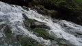Aerial drone shot green rocky waterfall jungle valley in Bali 4k or 4k+ Resolution