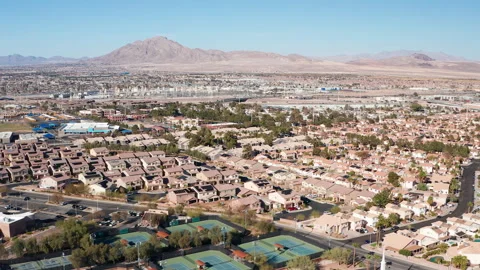 Aerial drone shot of Henderson Las Nevada residential homes strip mountains 03 Stock Footage 304276341