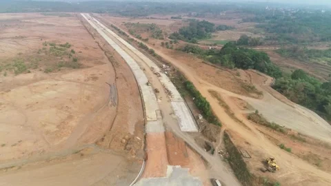 Aerial drone shot of highway construction site and heavy equipment Video stock 346264308