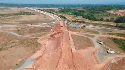 Aerial drone shot highway construction site heavy equipment Video stock 346423645