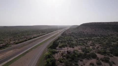 Aerial drone shot of interstate highway through west texas desert landscape.. Stock Footage 337632220