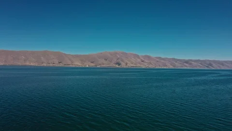 Aerial drone shot of Lake Sevan on background of Mount Ararat Vídeo Stock 124101571
