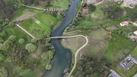 Aerial drone shot of Lima River and Castelo do Neiva village in Portugal Stock Footage 338310790