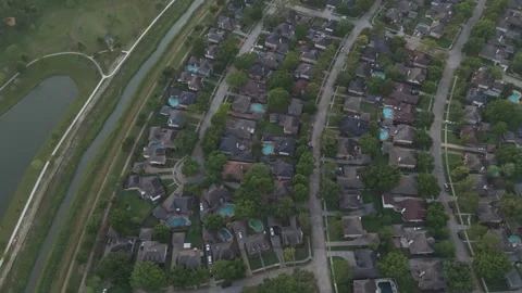 An aerial drone shot looking down at a suburban neighborhood featuring Video stock 337825518