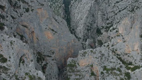 Aerial drone shot looking down into the deep rocky Gorropu Canyon in Sardinia, Stock-Footage 346821124
