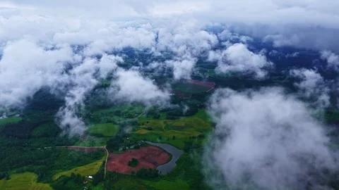 Aerial Drone Shot of Low Clouds Floating Over Rural Farmland With Ponds and Video stock 337386381
