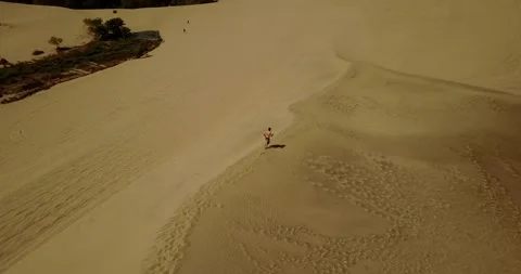 Aerial Drone Shot Of a Man in Huacachina, Peru 4K Stock Footage