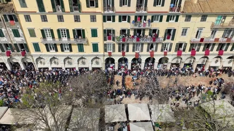 Aerial Drone Shot of Massive Crowds and a Philharmonic Band Parade at the Video stock 333722743