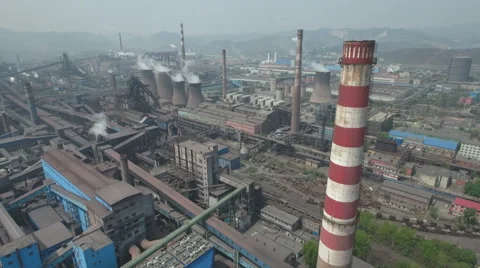 Aerial drone shot of massive steel factory, heavy industry pollution China Stock Footage