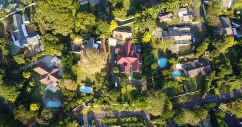 Aerial drone shot of a mid income residential area in a green city Stock Photos