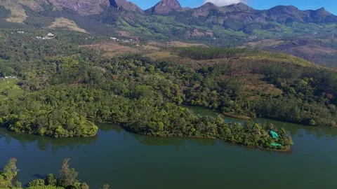 Aerial Drone Shot of Munnar Tea Plantations and Man Rowing Stock Footage 328332368