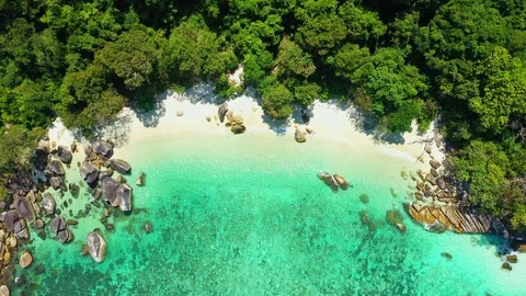 Aerial drone shot of ocean waves, beach and rocky  Video stock 123709898