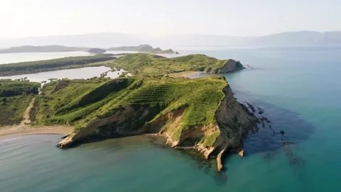 Aerial drone shot of ocean waves rolling and crashing on a island Stock-Footage 244774479