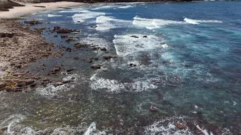Aerial Drone Shot of Ocean Waves Breaking on a Rocky Portuguese Shore Vídeos de archivo 345841098