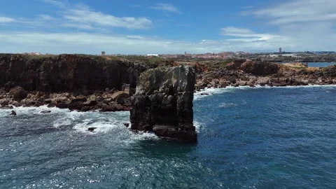 Aerial Drone Shot of Ocean Waves Breaking on a Rocky Portuguese Shore Stock-Footage 345841123