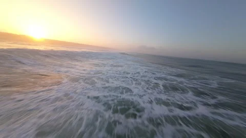 Aerial drone shot of ocean waves at golden hour 库存影片 346168364