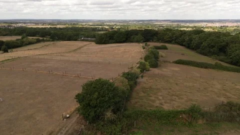 Aerial Drone Shot of Open Fields near Hockley with the train passing by, Essex 스톡 동영상 331859206