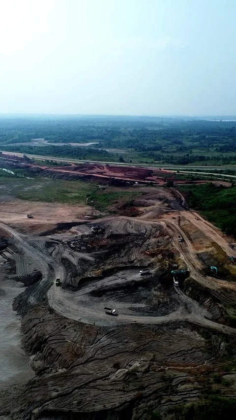 Aerial drone shot open pit mining earthwork excavation Stock Footage 346423759