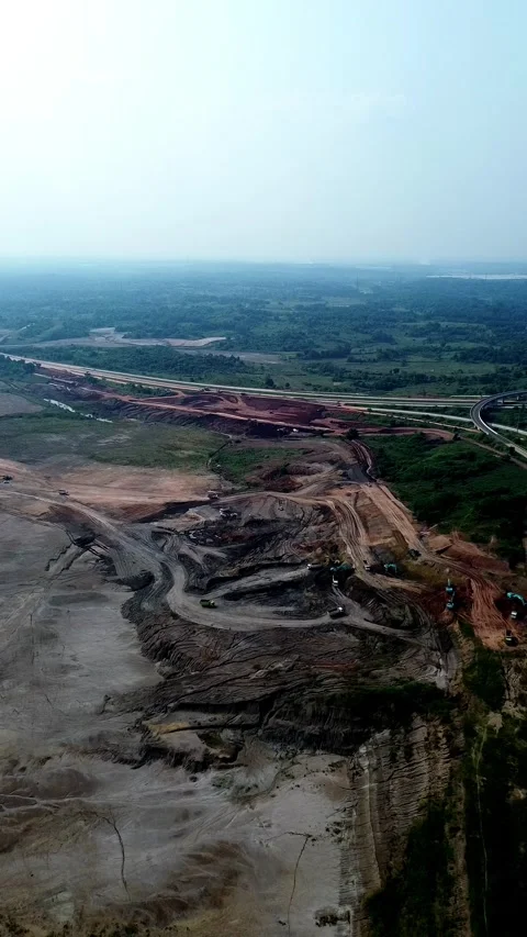 Aerial drone shot open pit mining excavation industrial site Stock Footage 346423773