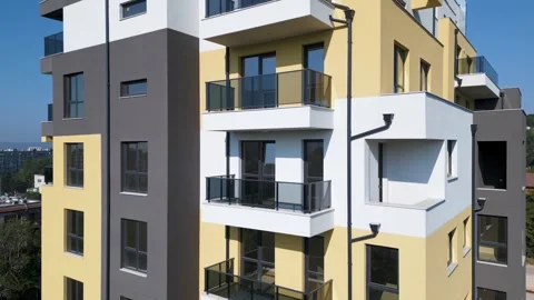 Aerial drone shot orbiting a modern residential building with clean architecture Stock Footage 310659503