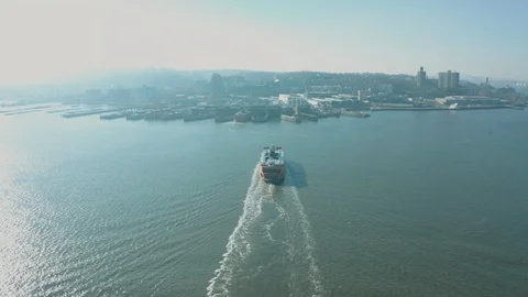 Aerial Drone Shot Orbiting Staten Island Ferry in New York Harbor near Sunset Stock Footage