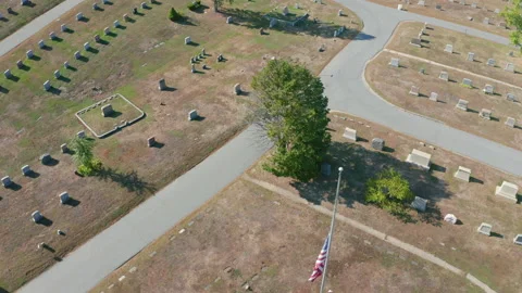 Aerial Drone Shot Orbiting a US Flag in Mt Feake Cemetery in Waltham Mass Stock Footage 143218109