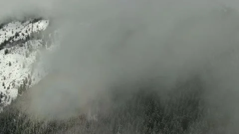 Aerial Drone Shot Over The Glacier National Park Montana Winter Forest Clouds Stock Footage 146669341