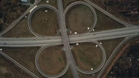 Aerial drone shot over road interchange, symmetric, bridges and moving vehicl Stock Footage 81574472
