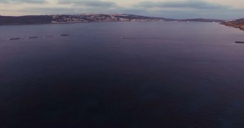 Aerial Drone shot over a small boat near fishfarms in Mellieha, Malta Stock Footage 75130113