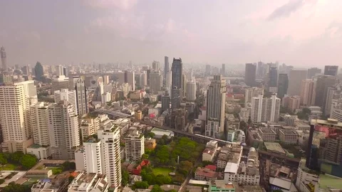 Aerial drone shot over Sukhumvit Road in central Bangkok, near Asok Stock Footage