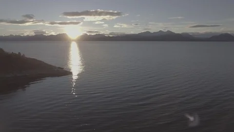 Aerial Drone Shot over Water at Sunrise Stock Footage