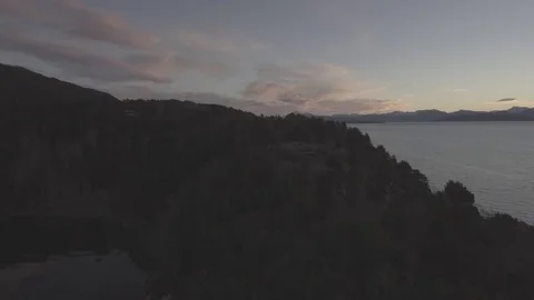 Aerial Drone Shot over Water at Sunrise Stock Footage