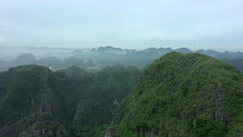 Aerial drone shot of panoramic view of landscape in Ninh Binh national park Stock Footage 166544232
