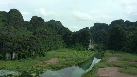 Aerial drone shot of panoramic view of landscape in Ninh Binh National park Stock Footage 166544702