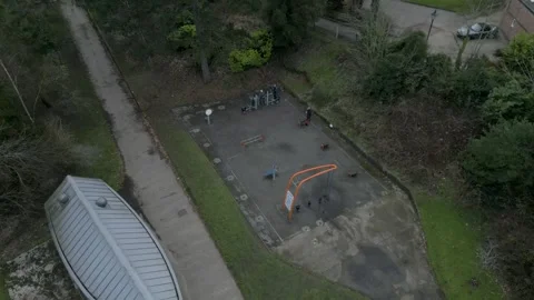 Aerial Drone shot of people exercising in park pull back Stock Footage 242121653