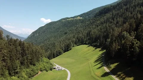 Aerial drone shot of pine trees forest in Alps green valley, in summer Stock Footage 145159245