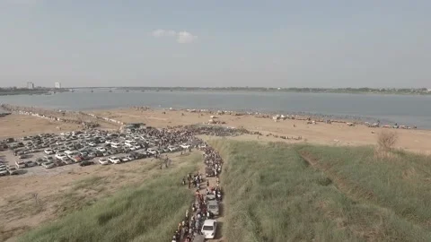 Aerial drone shot of queue of vehicles waiting line at local toll bamboo bridge Stock Footage 165324013